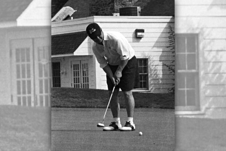 From the 2003 fifteenth annual Golf Classic souvenir program book, this photo's caption reads "Steve Kracjes showing it all comes down to the putt."