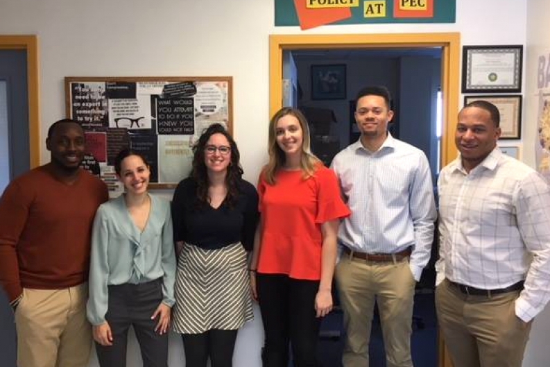 PLSE attorney poses with law students