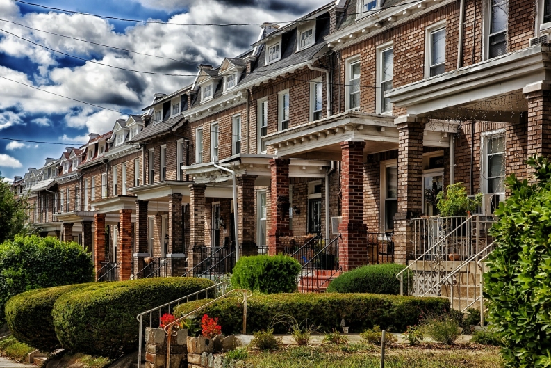 Image of row homes lining a street. 