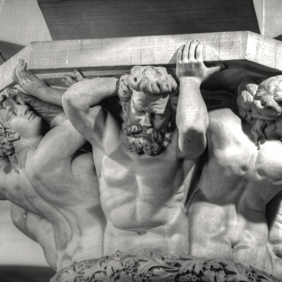 Statue holding pillar