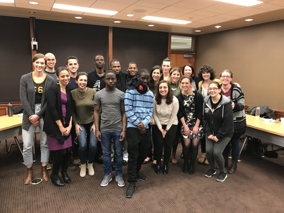 Law students and children posing for a picture