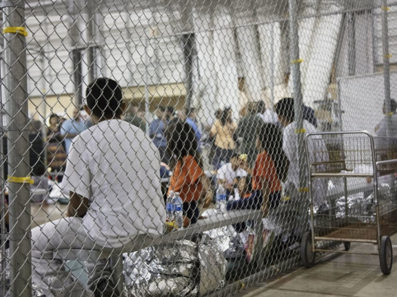 People siting in a cage.