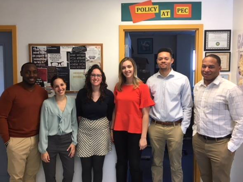 PLSE attorney poses with law students