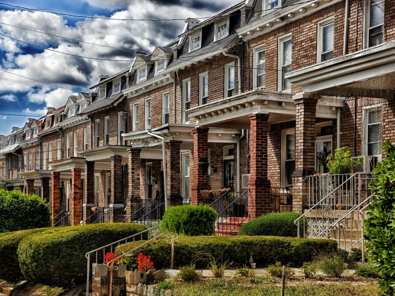 Image of row homes lining a street. 