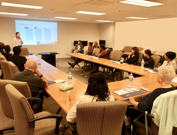 People sitting around a conference room