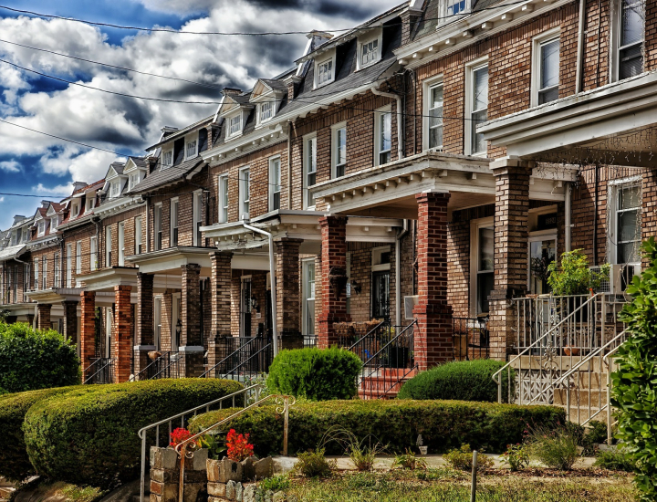 Image of row homes lining a street. 